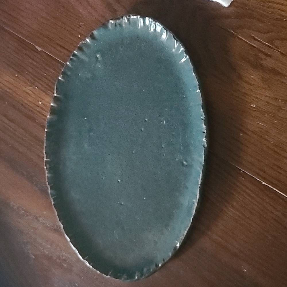 Flat pottery dish for jewelry or decorative